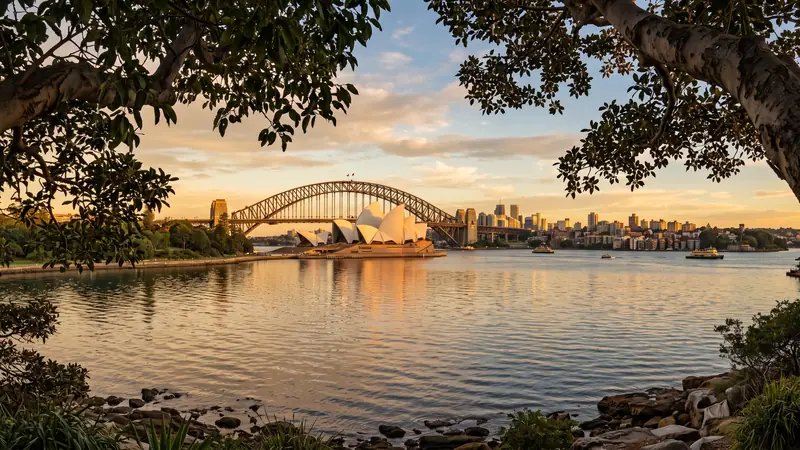 Sydney Harbour with Opera House and Harbour Bridge at golden hour, New South Wales