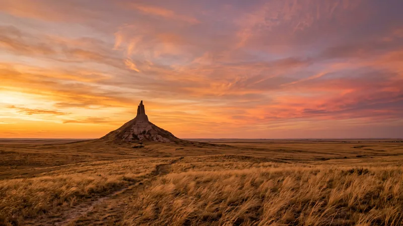 Chimney Rock silhouetted at sunset on the plains, Nebraska