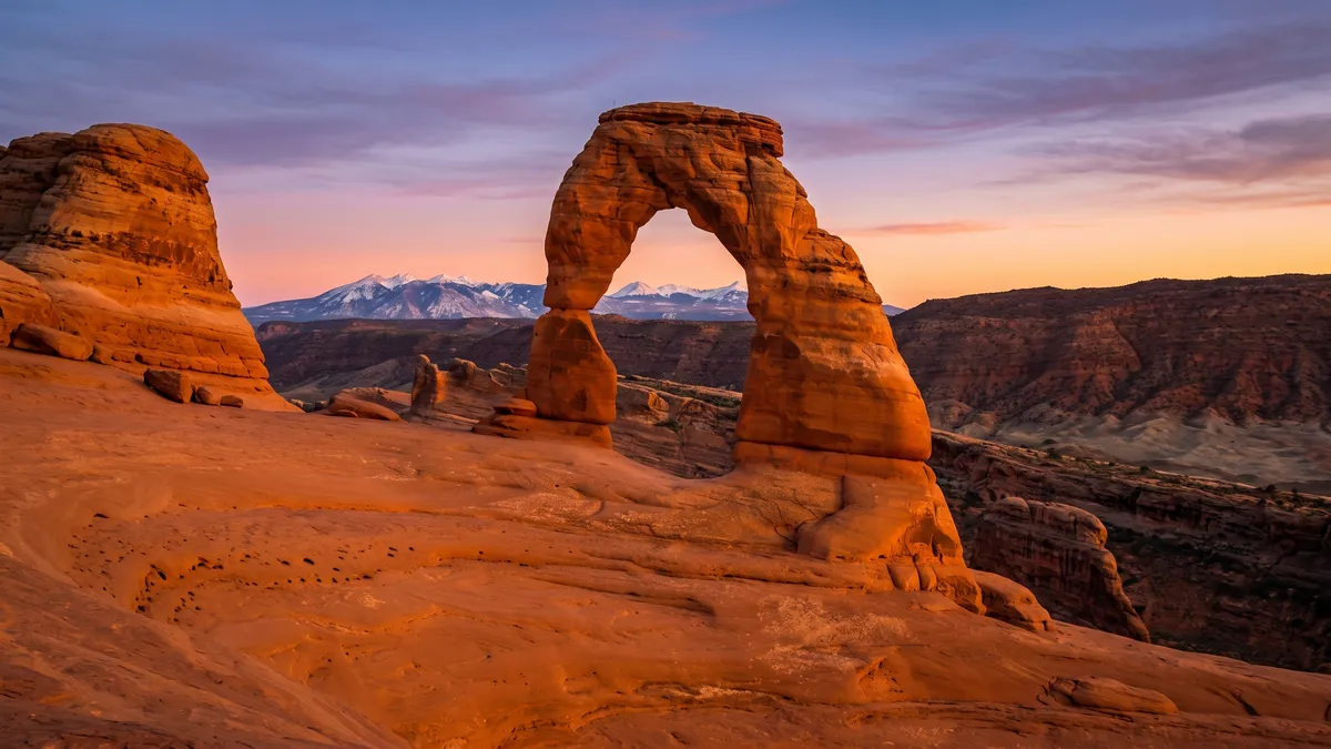 Delicate Arch glowing at sunset, Arches National Park, Utah