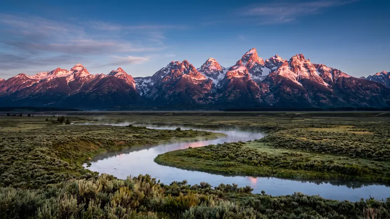 Grand Teton peaks above Snake River at sunrise, Wyoming