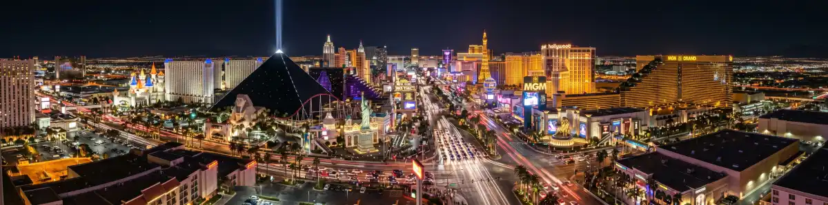 Las Vegas Strip panorama at night with famous hotel-casino buildings lit up in colorful lights