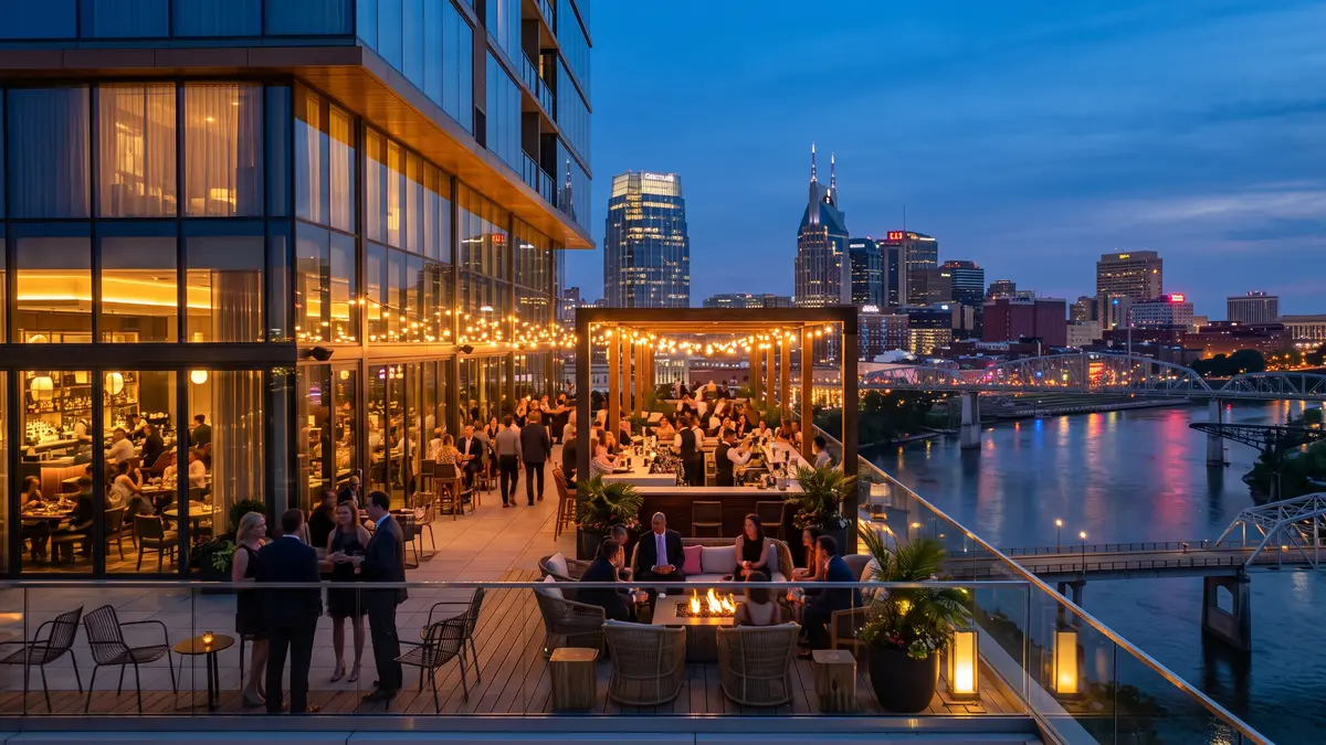 Nashville downtown skyline at night with hotels lit up near Bridgestone Arena and Broadway