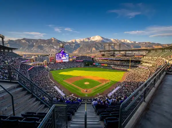 View from the upper deck at Coors Field looking down at the baseball diamond with Rocky Mountain panorama