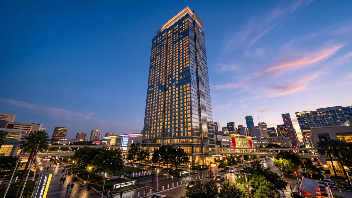 Downtown Houston hotel skyline near Daikin Park at dusk