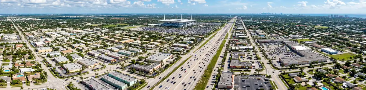 Aerial view of I-95 highway approach to Miami Gardens with Hard Rock Stadium in the distance
