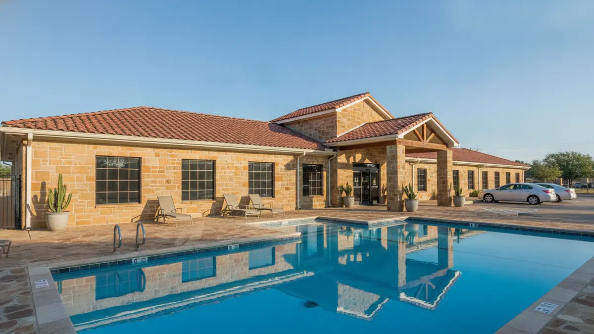 Red Roof Plus Medical Center exterior with clean rooms and pool near Houston Zoo and Hermann Park