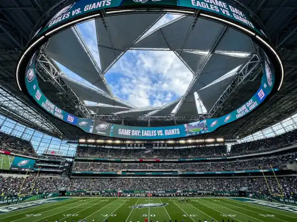 Inside Mercedes-Benz Stadium showing the aperture roof and halo video board