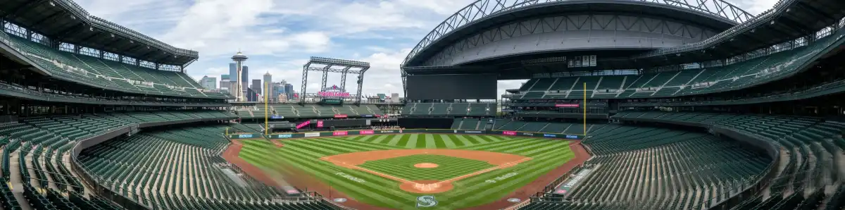 Inside T-Mobile Park during a Mariners game with view from upper deck showing the field scoreboard and retractable roof