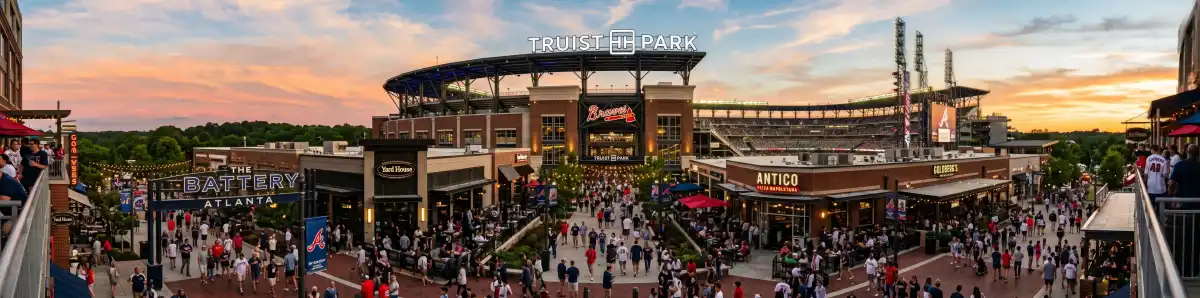 Truist Park exterior at golden hour with Atlanta Braves fans walking toward the home plate entrance along Battery Avenue