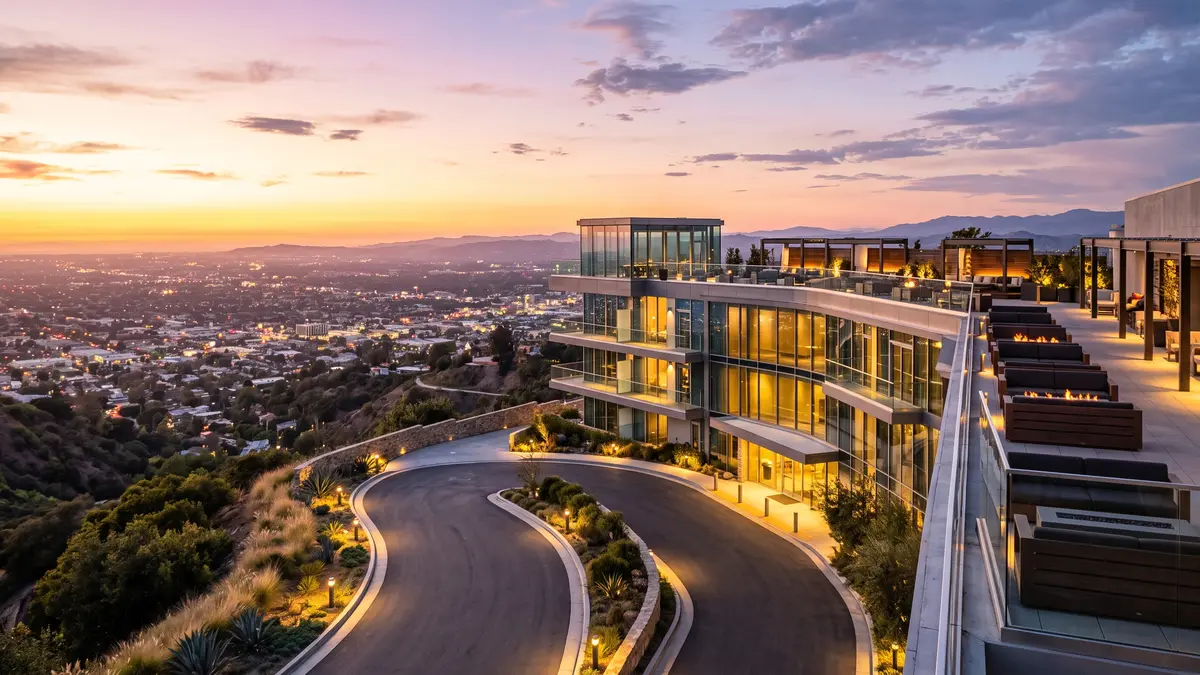 Hilton Universal City hotel exterior with pool and Universal Studios Hollywood hillside in background
